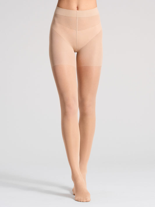 Nude traveler tights featuring a comfortable waistband, perfect for long-duration wear and travel comfort.